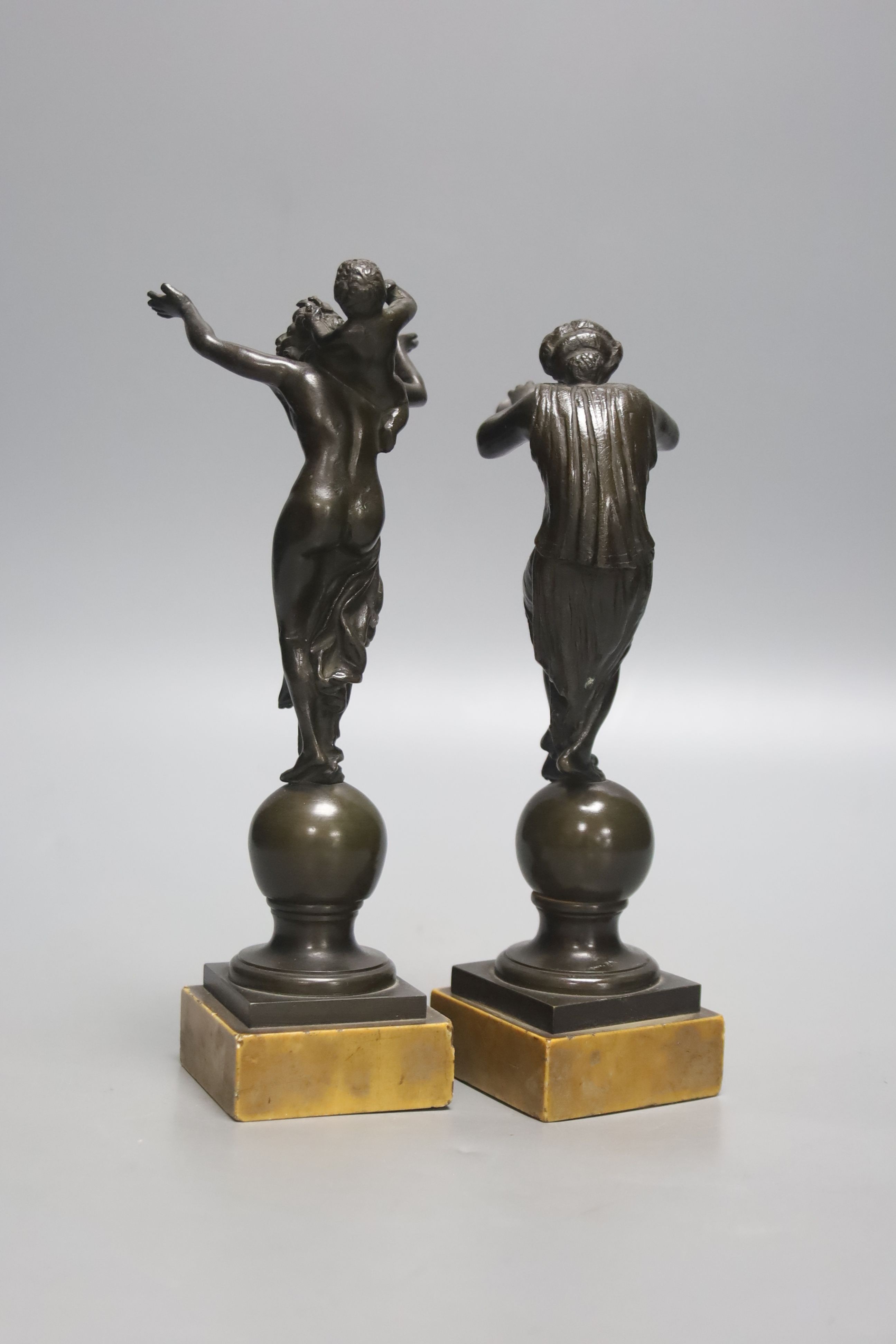 After the Antique. A pair of Grand Tour bronze classical figures, unsigned, on marble plinths, height 19cm